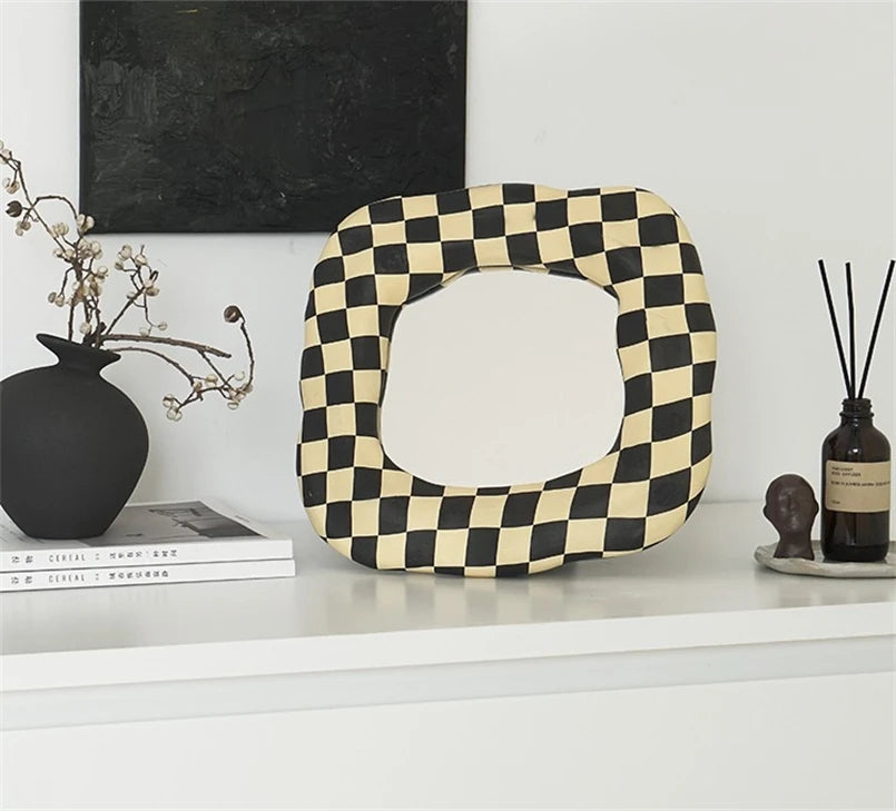 beige and black checkerboard mirror with handmade shape