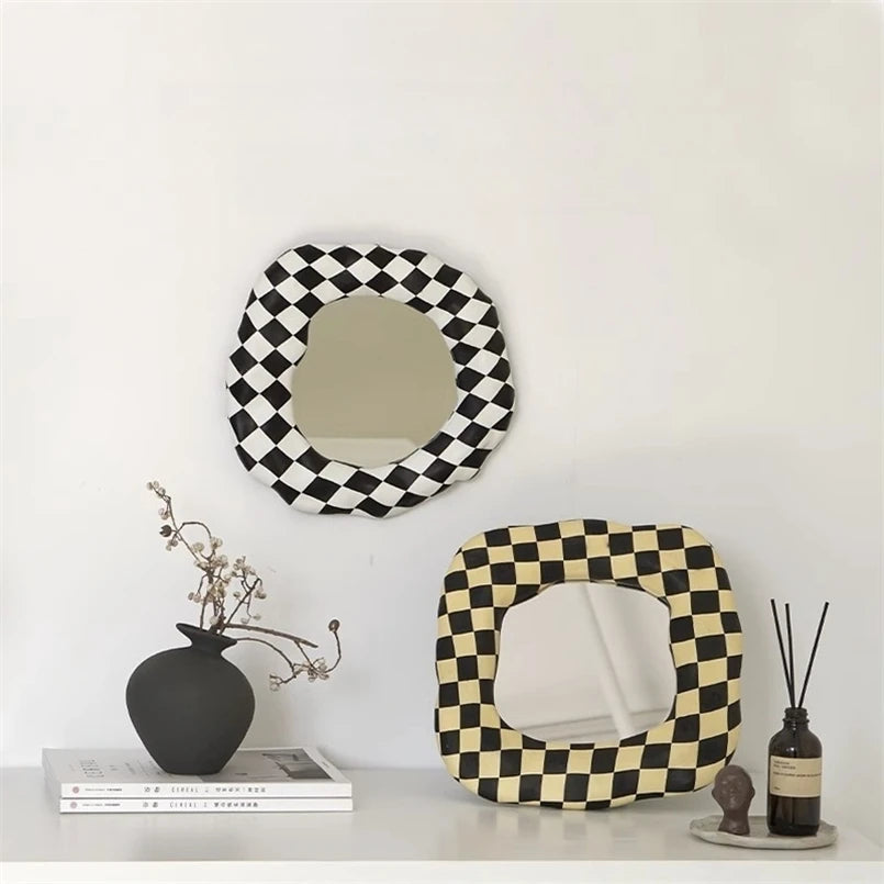 black white and beige checker print mirrors with organic shapes